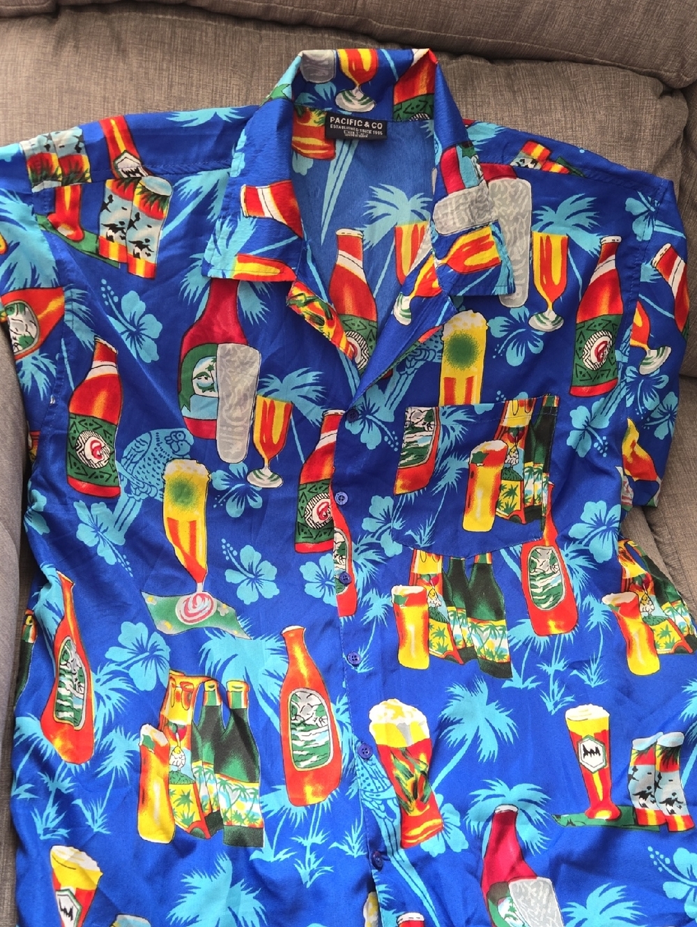 Pacifica Blue Hawaiian Shirt with Multicolor Bottle and Tropical Print